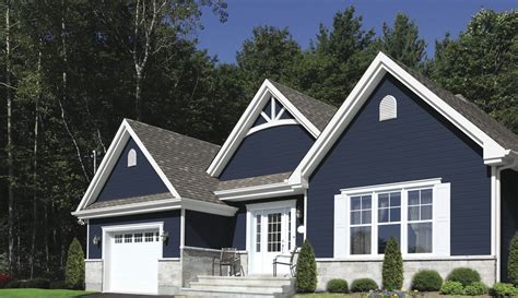 dark blue house with white trim and metal roof|dark blue house ideas.